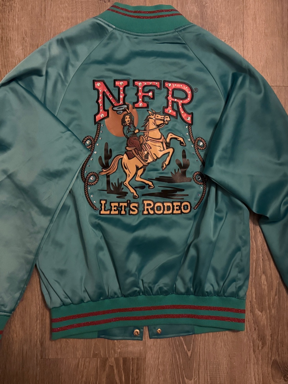 Teal Satin Varsity Jacket with 'Let’s Rodeo' Back Graphic